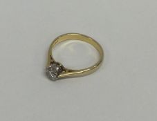 An 18 carat and platinum single stone diamond ring