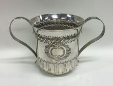 A Georgian silver two handled cup with half fluted