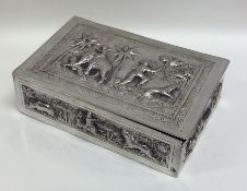 An Indian silver cigarette box decorated with anim