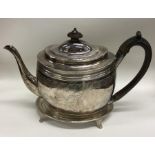 A good quality Georgian silver teapot on stand wit