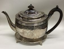 A good quality Georgian silver teapot on stand wit