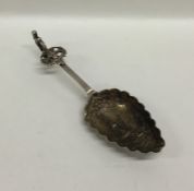 A Dutch silver preserve spoon embossed with windmi