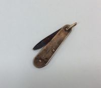 A small 9 carat fruit knife with loop top. Approx.