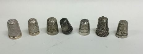 A bag containing numerous silver and other thimble