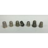 A bag containing numerous silver and other thimble