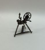 A novelty miniature silver dolls' house spinning w