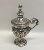 An Italian silver cup and cover embossed with flow