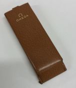 OMEGA: A good leather mounted wristwatch case. Est