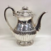 A good Georgian silver hot water pot with gadroon