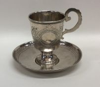 A Russian silver and silver gilt cup and saucer wi