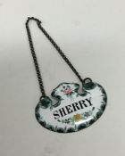 An unusual enamel decorated wine label for 'Sherry