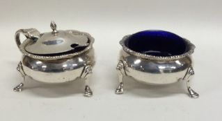 A Georgian style two piece silver cruet. Retailed