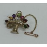 A 9 carat brooch in the form of a basket of flower