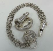 An unusual Victorian silver wall mounted whistle w
