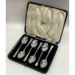 A boxed set of heavy silver teaspoons of plain tap