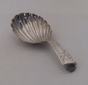 A Georgian silver bright cut caddy spoon engraved