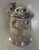 A George I silver fluted tankard with dome top to