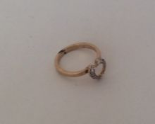 A 9 carat diamond heart shaped ring. Approx. 2.6 g