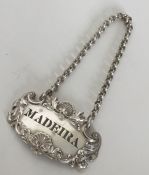 A heavy cast silver wine label for 'Madeira' with