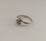 A 9 carat diamond crossover ring. Approx. 1.7 gram