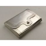 An unusual silver card case in the form of an enve