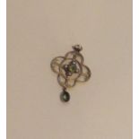 An attractive peridot and pearl pendant with loop