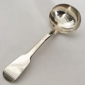 A heavy Georgian silver fiddle pattern sauce ladle