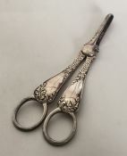 A pair of Edwardian silver grape scissors with scr