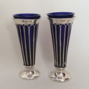 A tall pair of tapering silver spill vases with BG