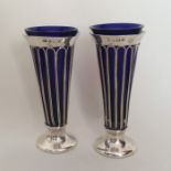 A tall pair of tapering silver spill vases with BG