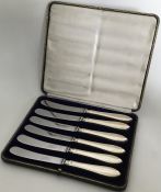 A stylish set of six silver handled tea knives con