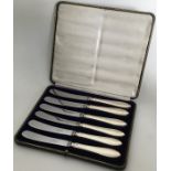 A stylish set of six silver handled tea knives con