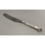 A Kings' pattern silver butter knife with steel bl