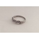 A six stone diamond twist ring. Approx. 2.5 grams.