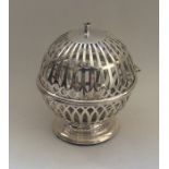 An unusual silver string holder of ball form with