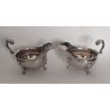 A pair of George II heavy silver sauce boats with