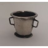An Antique silver model of a fire bucket with tape