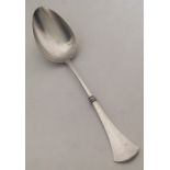 A Russian silver tablespoon with tapering handle.