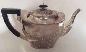 A large Edwardian silver half fluted teapot. Birmi