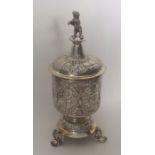 A large Continental silver cup and cover with gilt