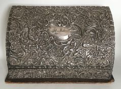 A silver embossed stationery cabinet decorated wit