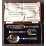 A cased silver handled three piece fruit set. Shef