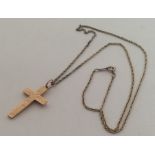 A 9 carat engraved cross on fine link chain. Appro