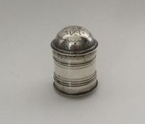 An unusual shaped silver nutmeg grater with bright