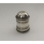 An unusual shaped silver nutmeg grater with bright