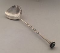 A E JONES: A stylish silver spoon with twisted ter