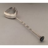 A E JONES: A stylish silver spoon with twisted ter