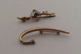 Two gold and stone set brooches. Approx. 2.5 grams