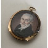 A large oval gold miniature depicting a gentleman