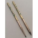 A stylish and rare pair of enamelled pens decorate